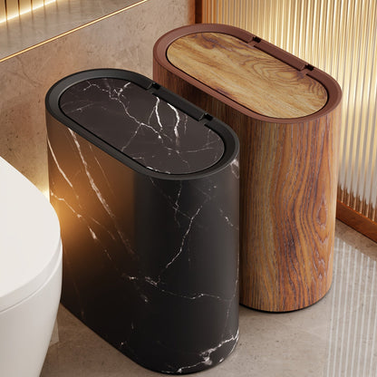 Mara Kitchen Trash Can with a modern marble pattern and space-saving oval design, perfect for contemporary kitchens. 1